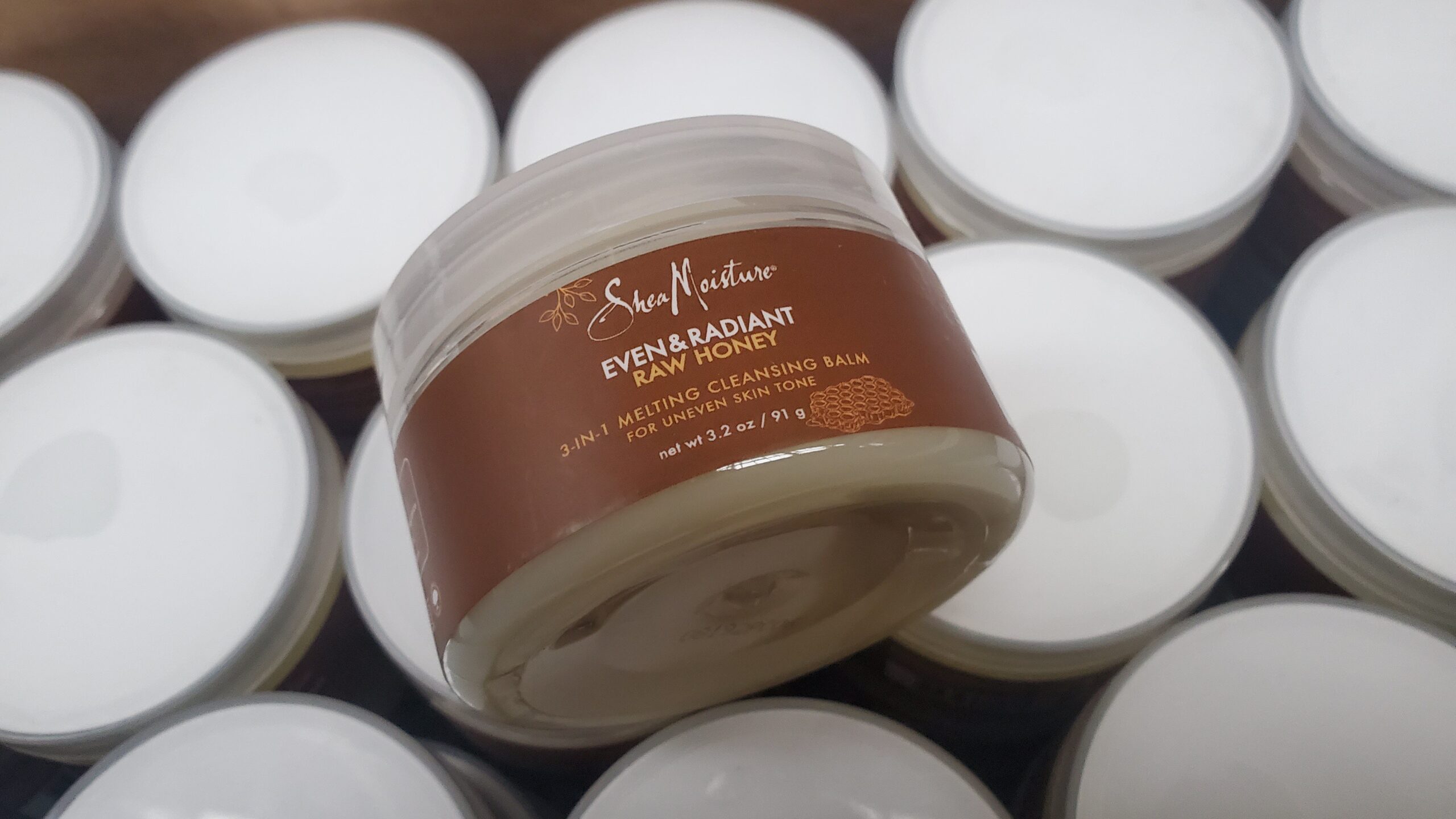 Lot of Shea Moisture Even & Radiant Raw Honey 3-in-1 Melting Cleansing Balm 156pcs Shea Moisture cleansing balm lot of 156 Raw Honey melting cleansing balms arranged for shipping from Save More Liquidations