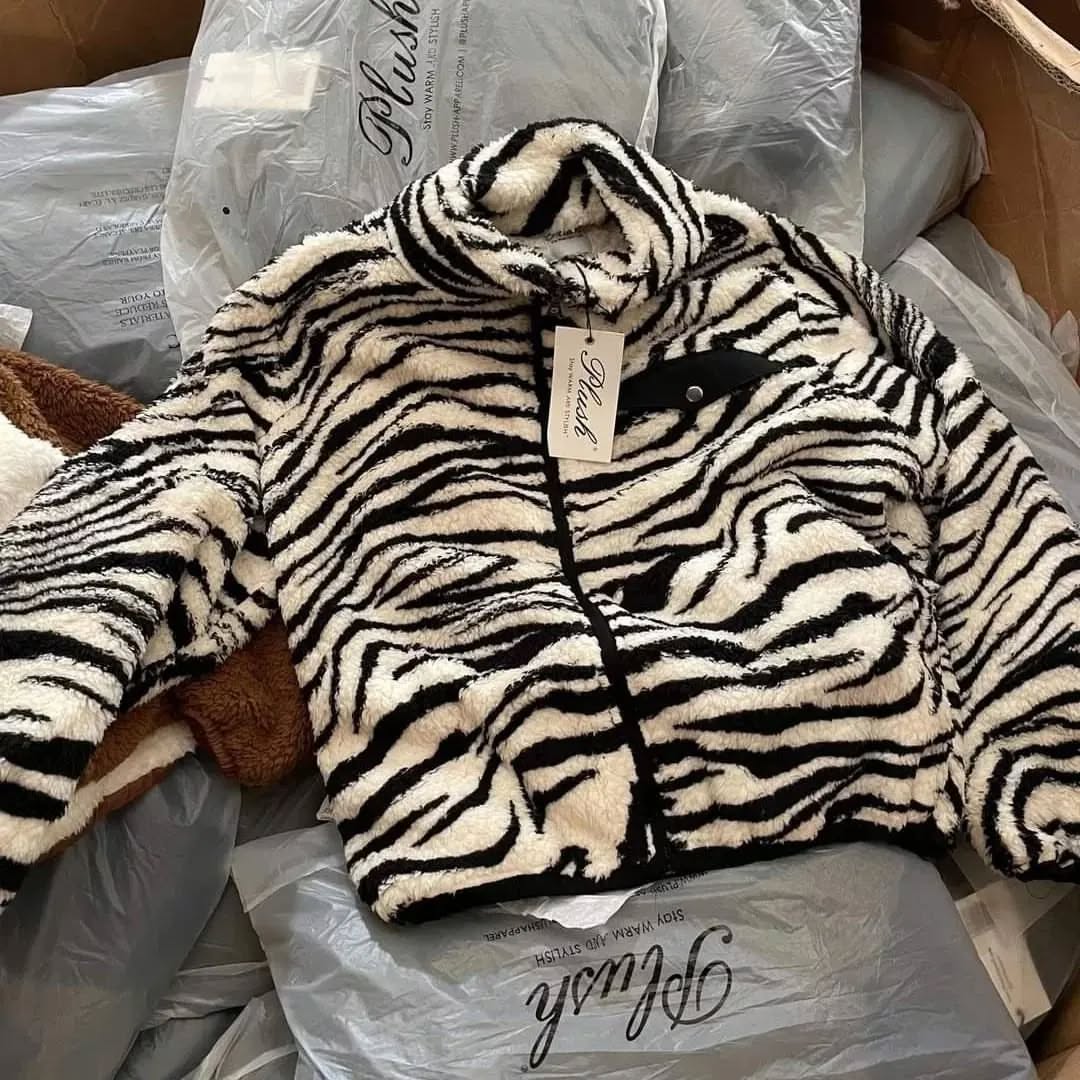 Sherpa Jackets – PLUSH Pallet Sherpa jackets pallet of plush fleece-lined outerwear wrapped for shipping from Save More Liquidations