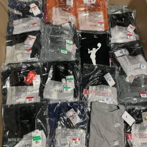 Nike men's shirts pallet — wrapped pallet of 250 to 600 brand new authentic Nike men's tops including Dri-FIT performance tees, graphic T-shirts, long-sleeve training tops, polos, and lifestyle crewnecks, folded and polybagged Grade A NWT condition