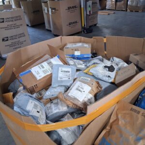 Return mail mystery pallet — single pallet of mixed-item return-flow mystery packages from USPS, UPS, FedEx, and Amazon return shipping