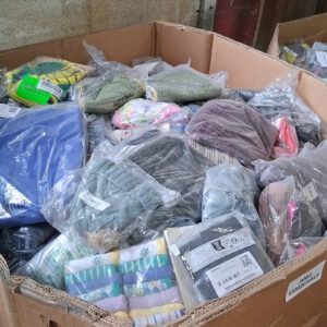 Amazon Essentials clothing pallet — wrapped pallet of 650 units of Amazon Essentials brand everyday apparel including basic tees, tops, bottoms, and casual wear, ready for reseller side hustle workflows