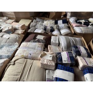 Target bedding truckload — 24 pallets of mixed Target bedding inventory including comforter sets, sheet sets, quilts, duvets, pillowcases, mattress pads, and pillows, mostly new and shelf-pull condition