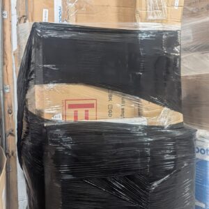 Mail stacked pallet of undelivered parcels and mixed returns wrapped for shipping from Save More Liquidations