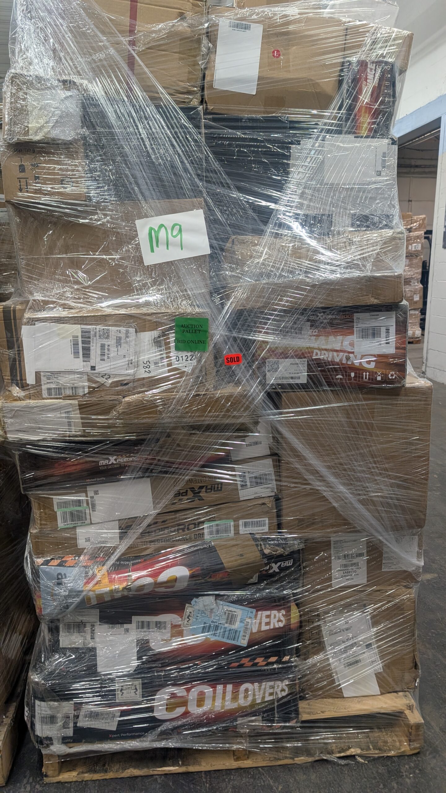 M9 – Heavy in Car Parts Car parts pallet of wholesale automotive parts and accessories shrink-wrapped for shipping from Save More Liquidations