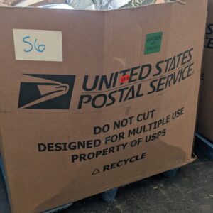 Mail and parcel pallet of undelivered and returned shipments wrapped for shipping from Save More Liquidations