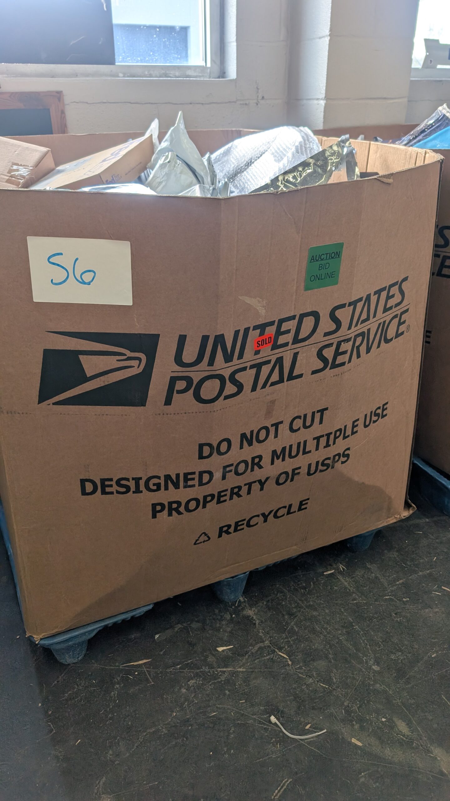 USPS HPC – S26 Mail and parcel pallet of undelivered and returned shipments wrapped for shipping from Save More Liquidations