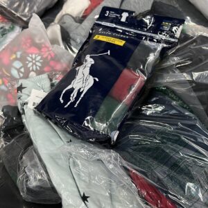 Amazon clothing pallet — wrapped pallet of 1,000 assorted Amazon apparel pieces including sweaters, jackets, blouses, activewear, jeans, and skirts in mixed sizes and brands