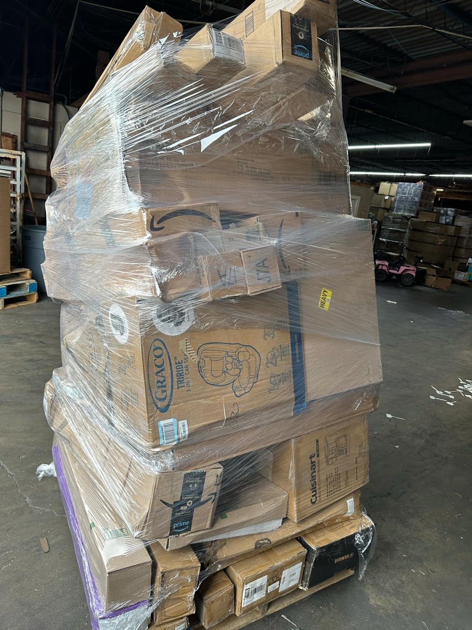 amazon-monster-pallets-buy-amazon-monster-pallets.jpeg Amazon monster pallet — oversized 7-8 foot tall wrapped pallet of Amazon returns merchandise, dense piece count across mixed general merchandise categories