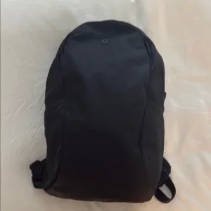 Lululemon backpack pallet — wrapped pallet of 200 units of authentic Lululemon backpacks including everyday backpacks, gym bags, yoga totes, and travel backpacks in mixed styles and colors, all new with tags