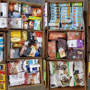 Grocery liquidation pallet of shelf-stable food and household goods wrapped for shipping from Save More Liquidations