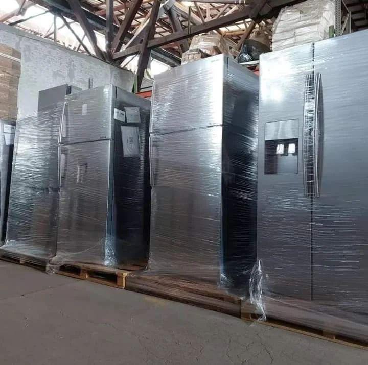 Refrigerators Liquidation Pallets – Wholesale Refrigerators pallet of fridges and coolers wrapped for shipping from Save More Liquidations