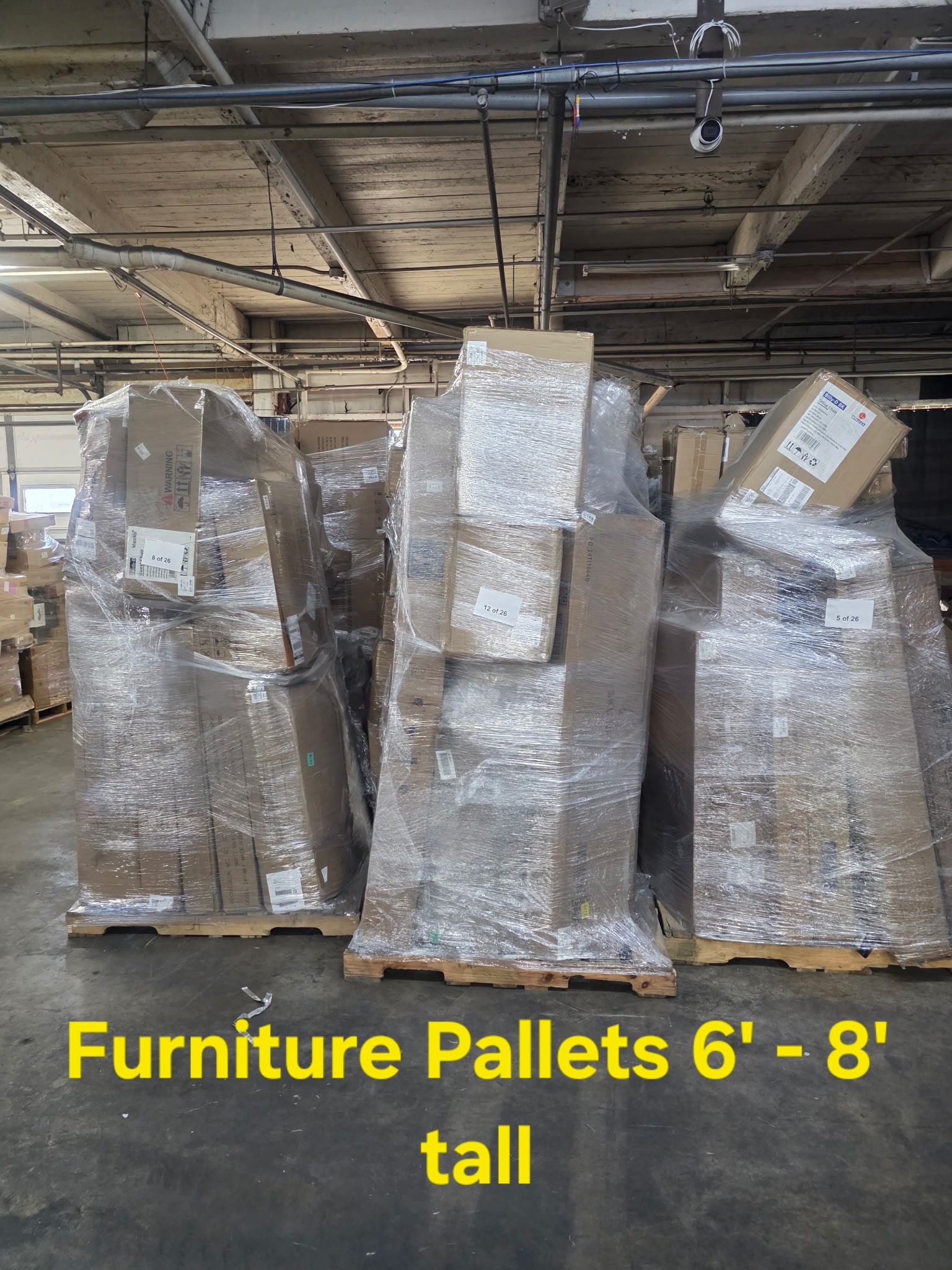 furniture-pallet-6ft-8ft-tall.jpg Furniture pallet 6ft-8ft tall — single tall vertical-stacked pallet of mixed-brand furniture including office chairs, gaming chairs, desks, bookcases