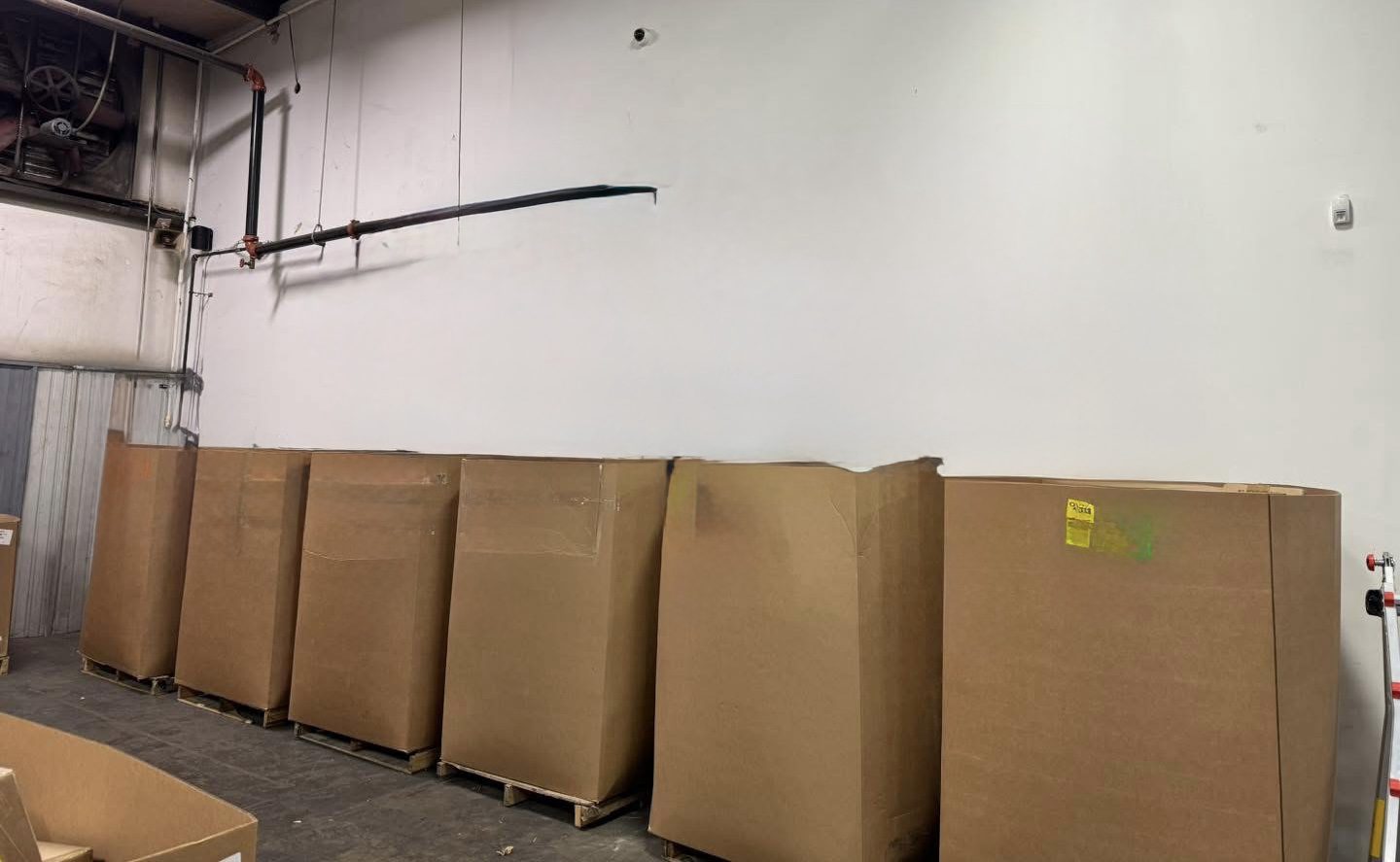 img_1536.jpeg Amazon HPC pallet — high piece count wrapped pallet of Amazon returns merchandise with dense SKU loading across mixed general merchandise categories