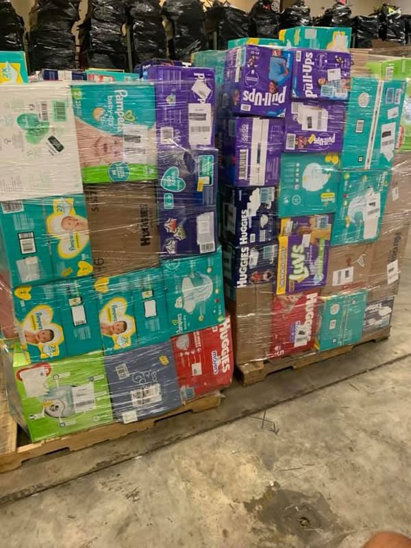 img_4024.jpeg Diapers pallet — single pallet of brand-name diaper inventory including Pampers Swaddlers, Huggies Little Snugglers, Luvs, training pants, and store brands