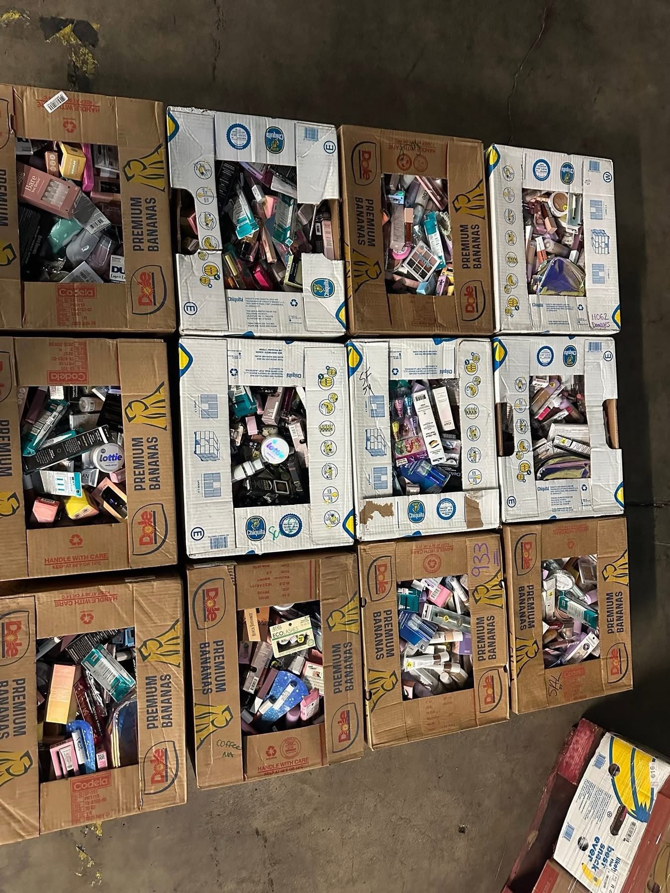 img_4221.jpeg Makeup liquidation pallet — single pallet of mixed-brand cosmetics makeup overstock including foundation, eye makeup, lip products, cheek products, and tools