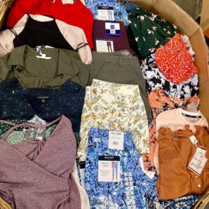 Macys womens clothing liquidation pallet — wrapped pallet of 900 pieces of mixed Macys womens apparel including everyday wear, special occasion outfits, workwear, athletic wear, and casual pieces from brands like INC International Concepts, Lauren Ralph Lauren, Free People, Levis, Nike, and adidas