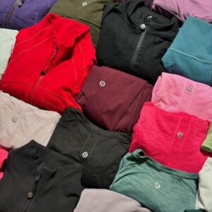 Lululemon clothes pallet entry tier — 150 units of authentic new-with-tags Lululemon women's activewear in manifested entry-tier mix including leggings, sports bras, tank tops, long sleeve tops, hoodies, sweatshirts, shorts, and jackets