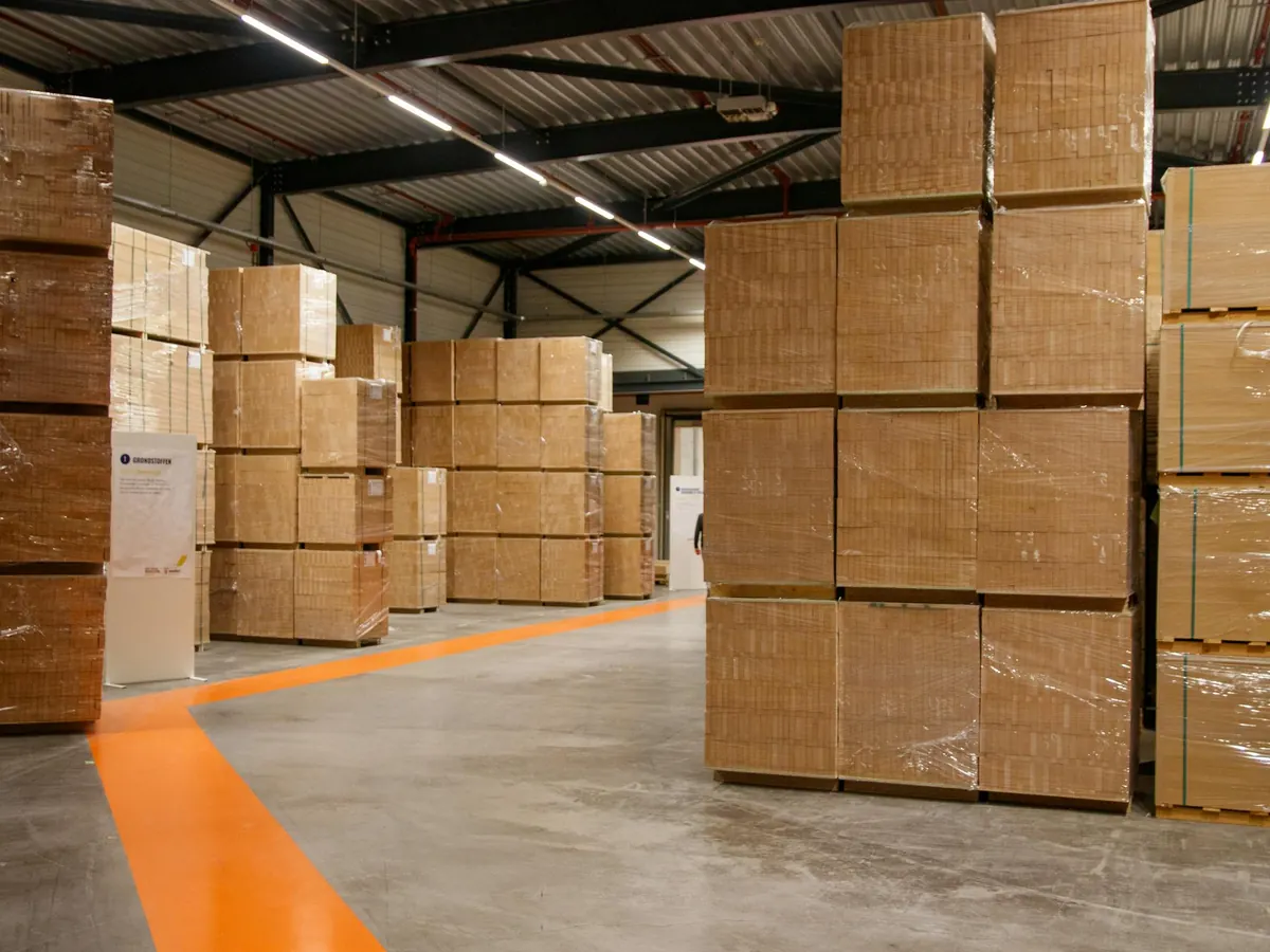 SaveMore warehouse aisle filled with palletized inventory